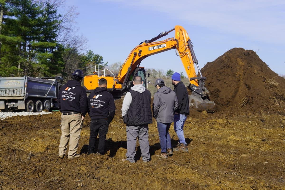 The IR Campbell crew reviews the DX400LC-9 during its trial at Patriot Park.
